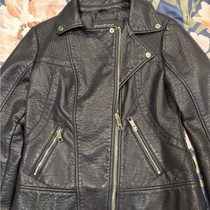 Guess black leather jacket, nice acrylic/polyester interior. Polyester exterior.